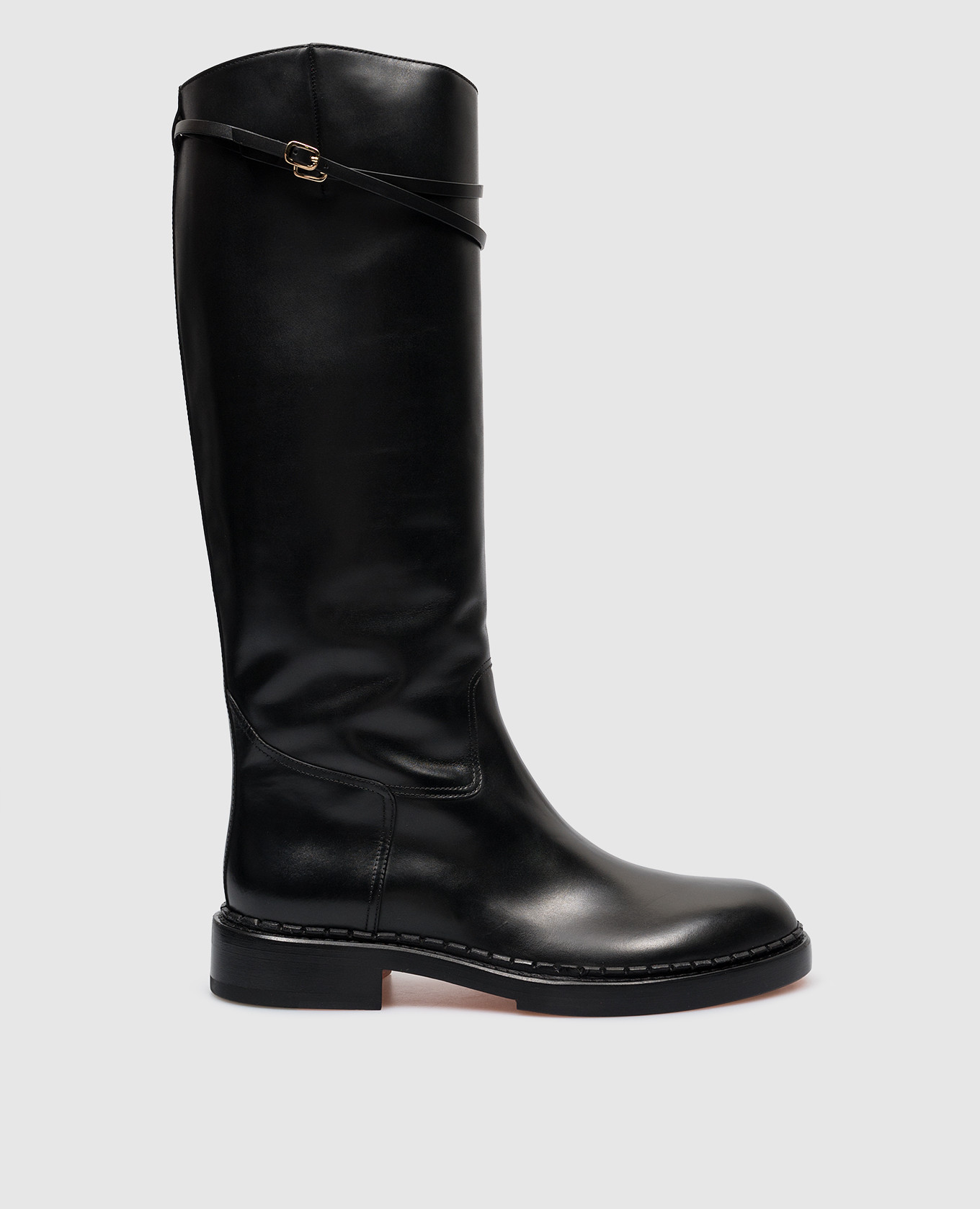 Black leather boots with straps