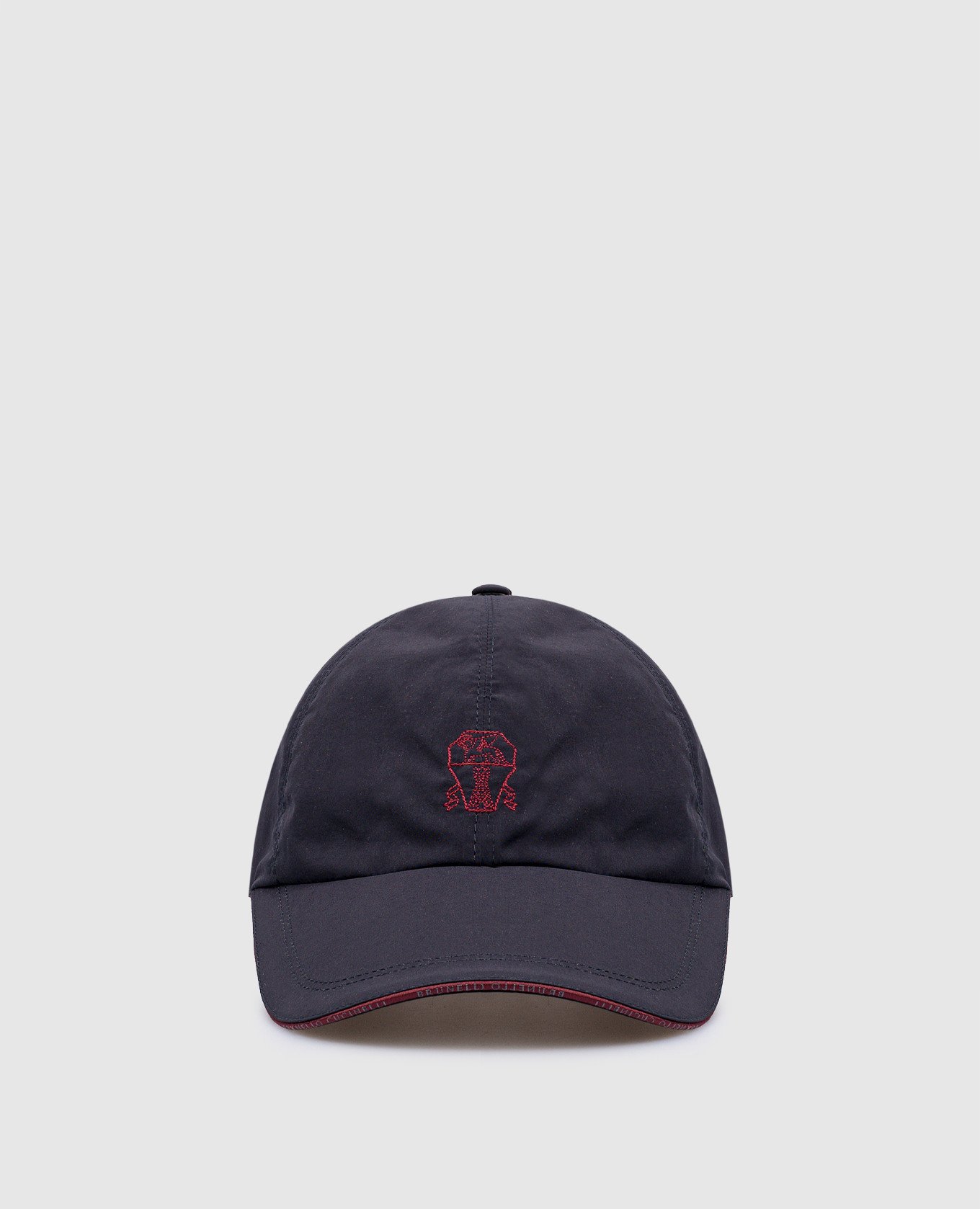 Blue cap with embroidered logo emblem
