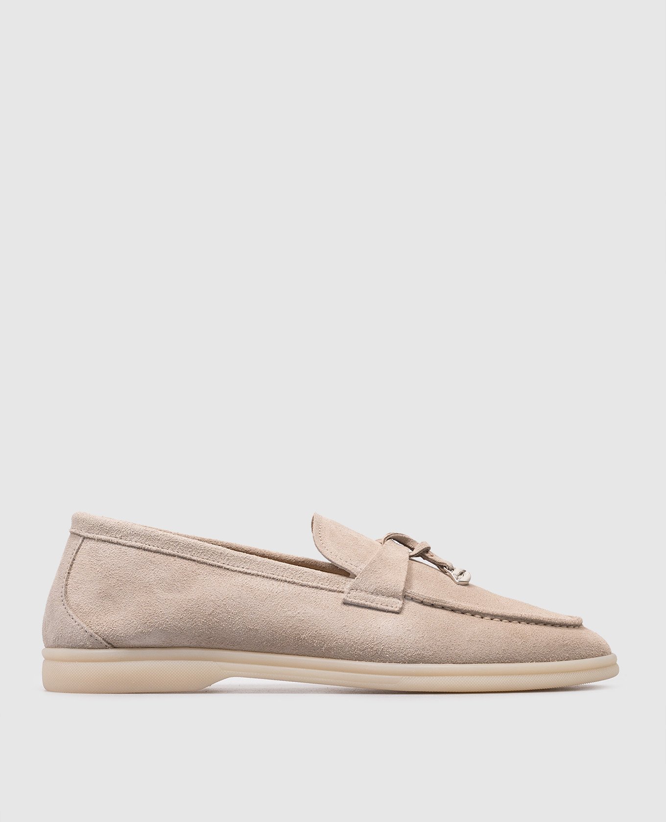Beige suede loafers with metallic logo