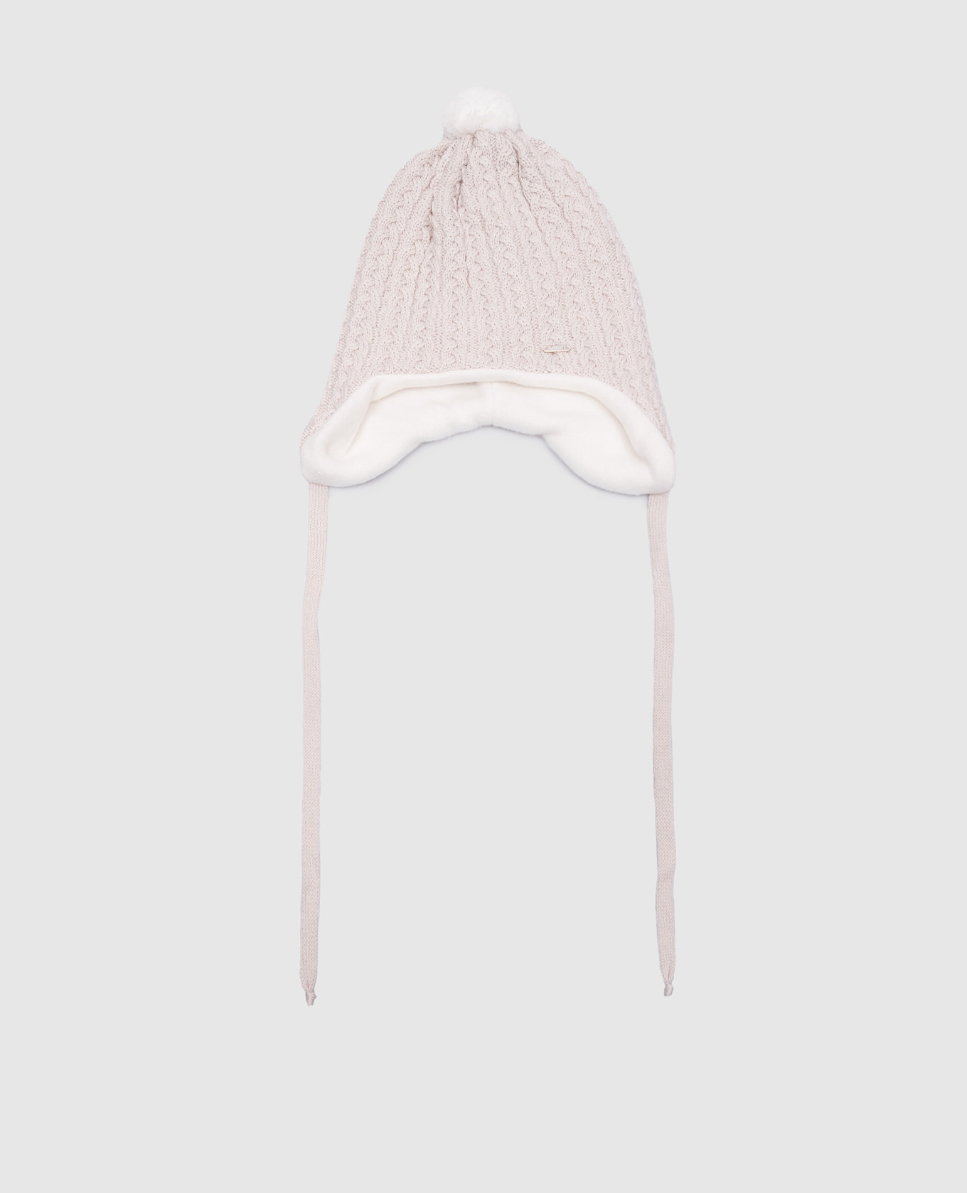 Children's beige hat made of wool with a textured pattern