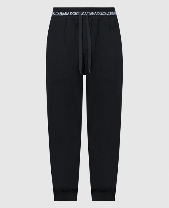 Black joggers with a logo pattern