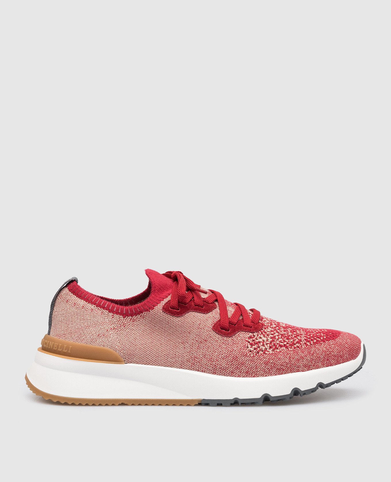 Red sneakers with a textured logo