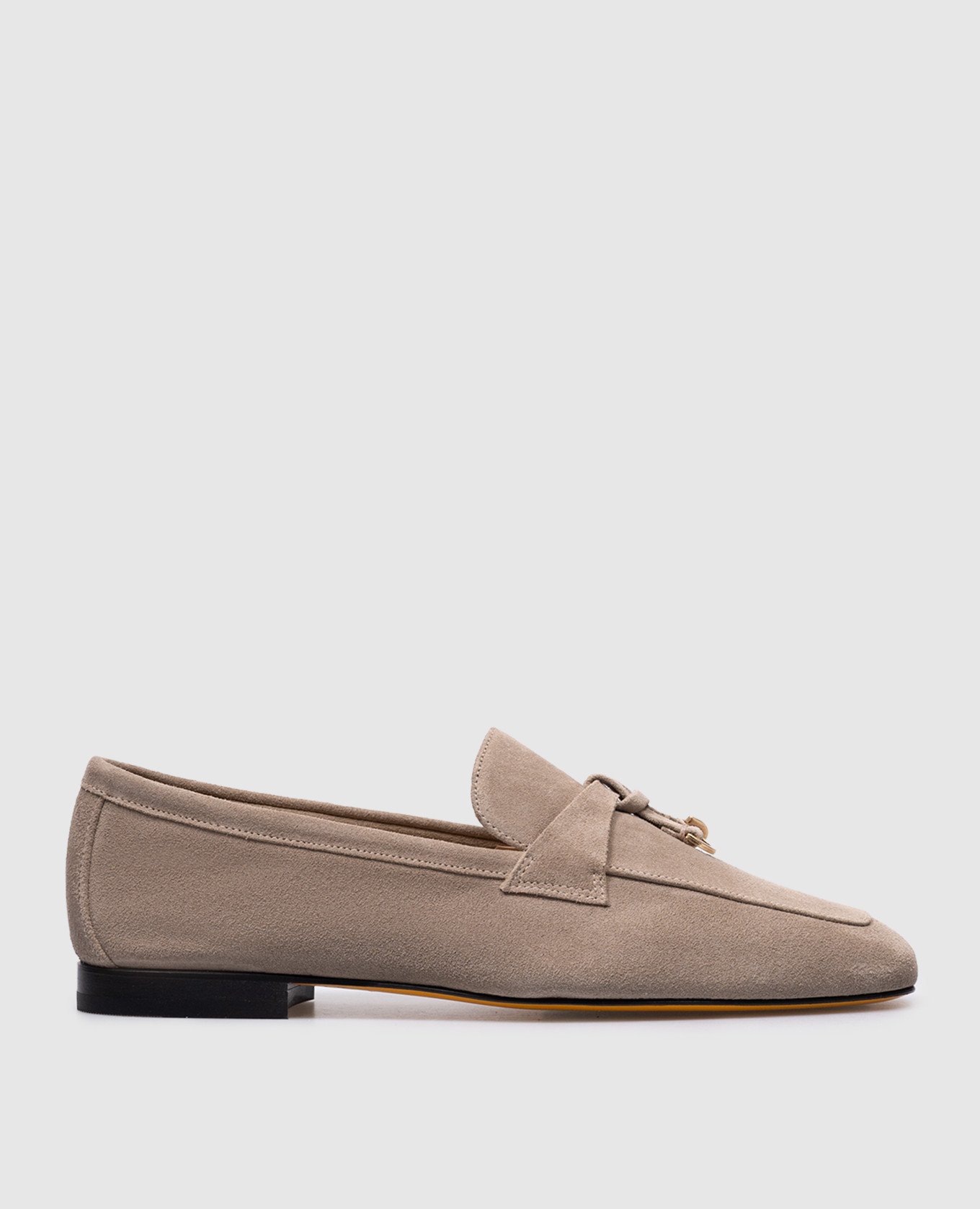 Beige suede loafers with metal pendants
