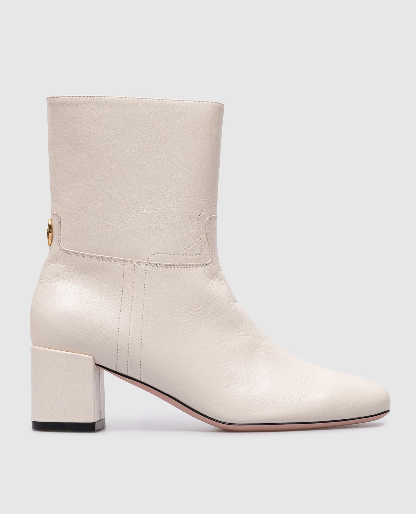 White leather ankle boots by Otavine