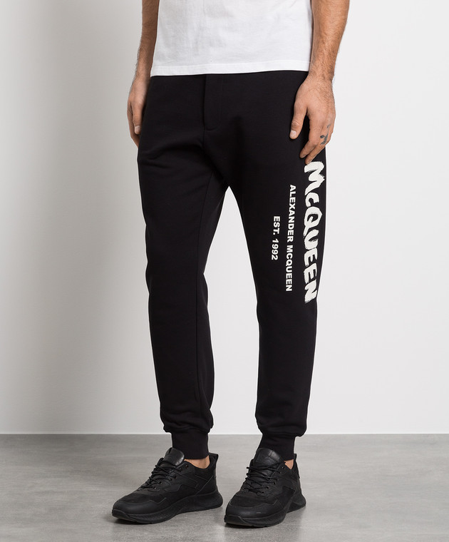 Black joggers with contrasting McQueen Graffiti print