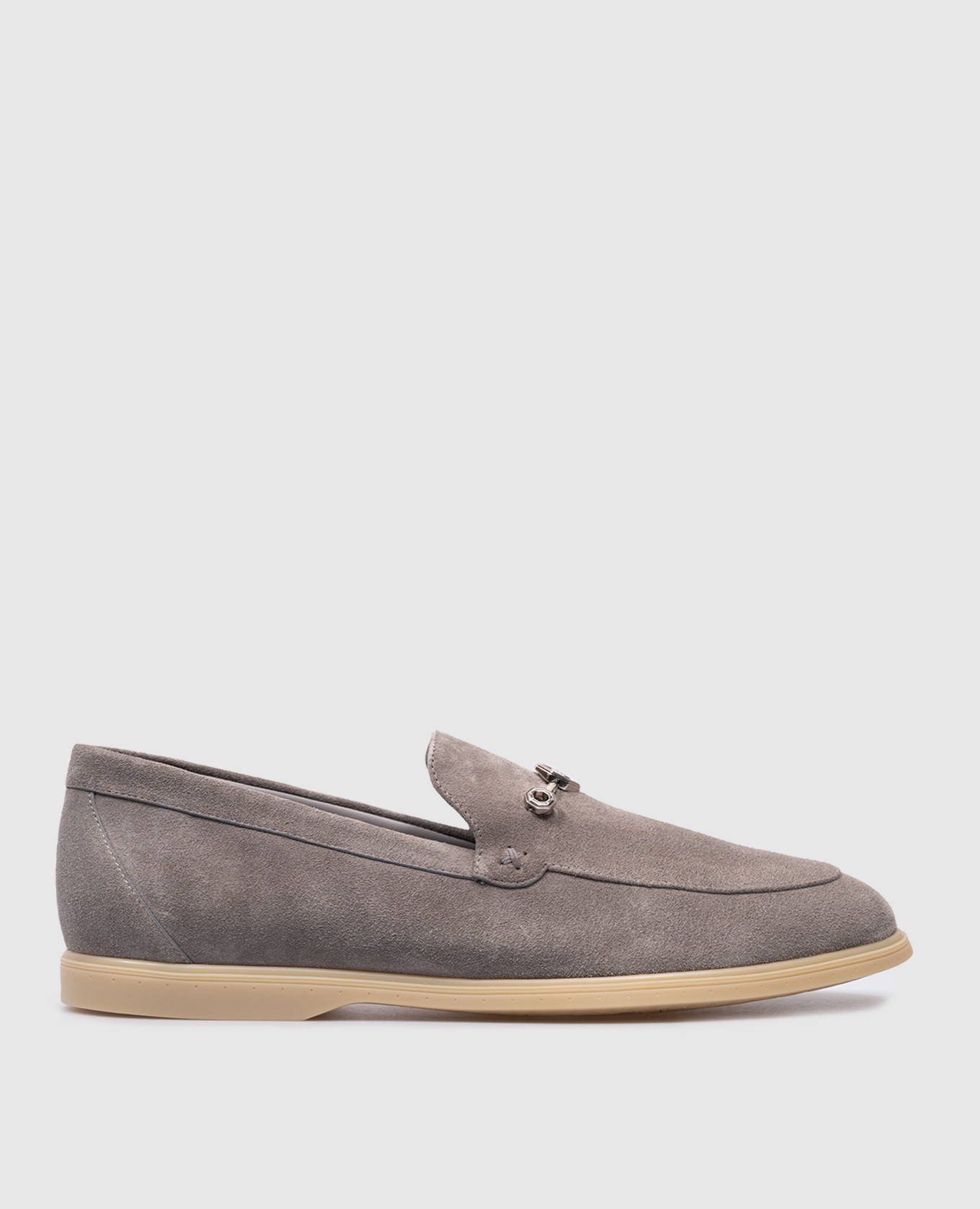 Gray suede loafers with metallic eagle head logo