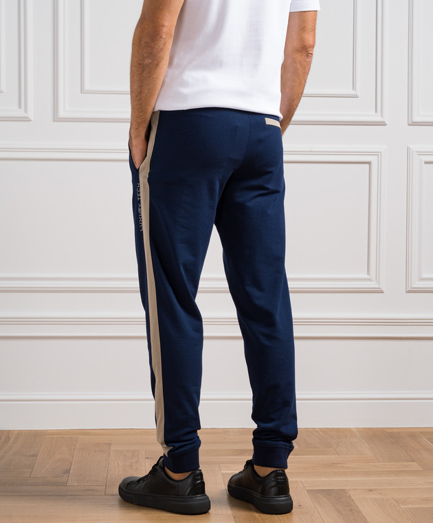 Blue joggers with white on sale stripe