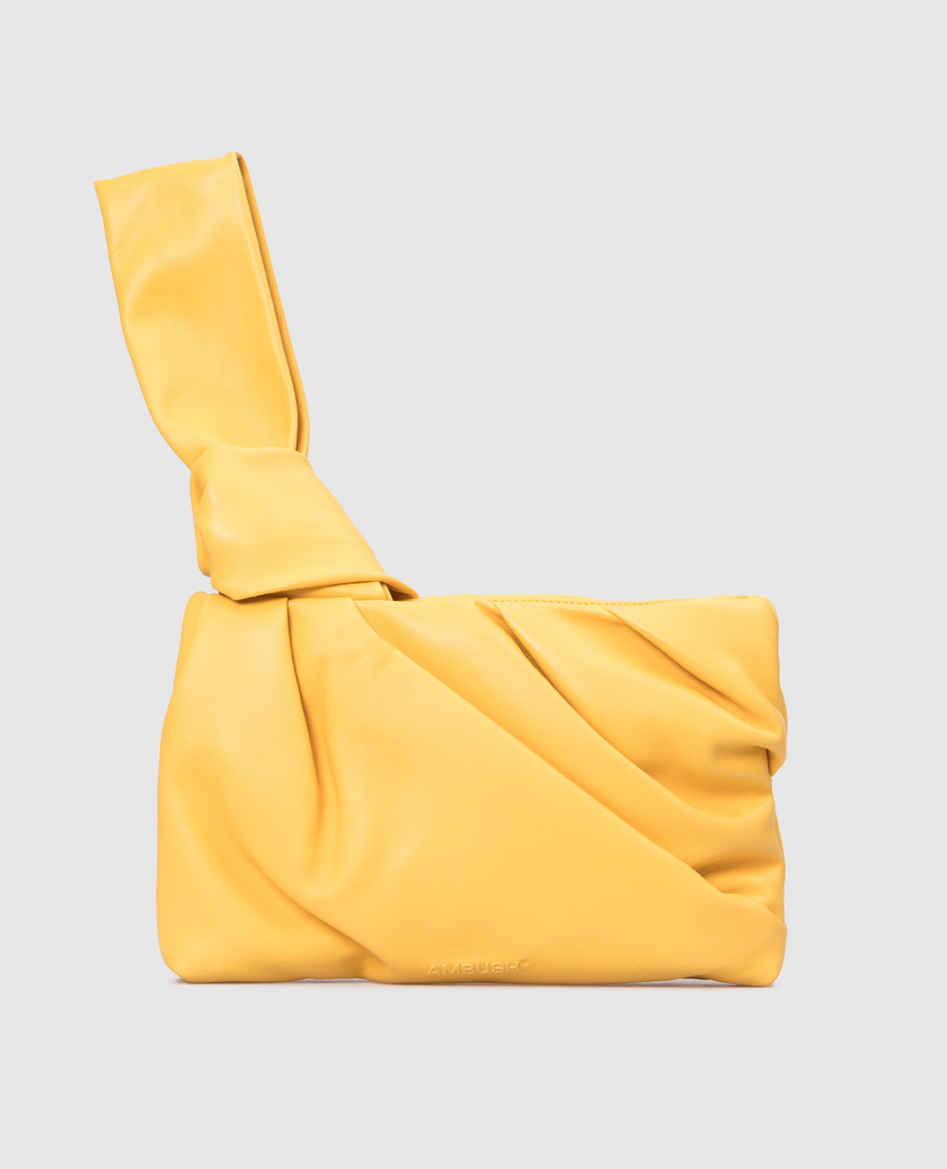 Желтый кожаный клатч с тиснением логотипа
