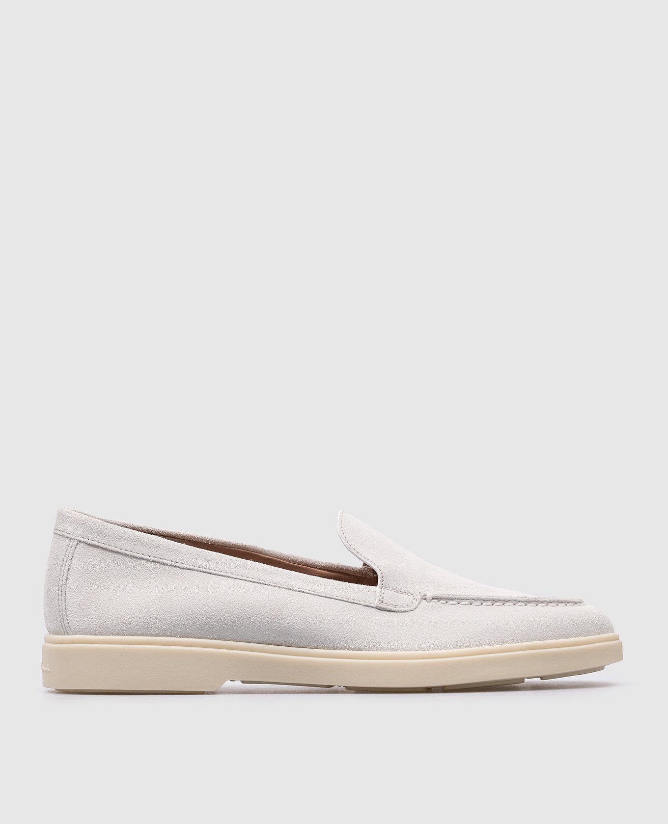 White suede loafers with textured logo