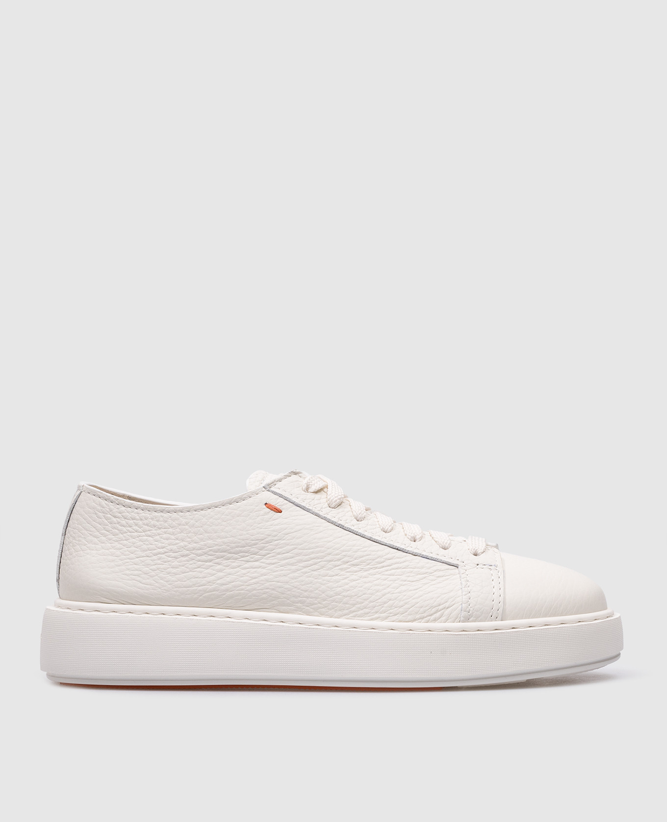 White leather sneakers with textured logo