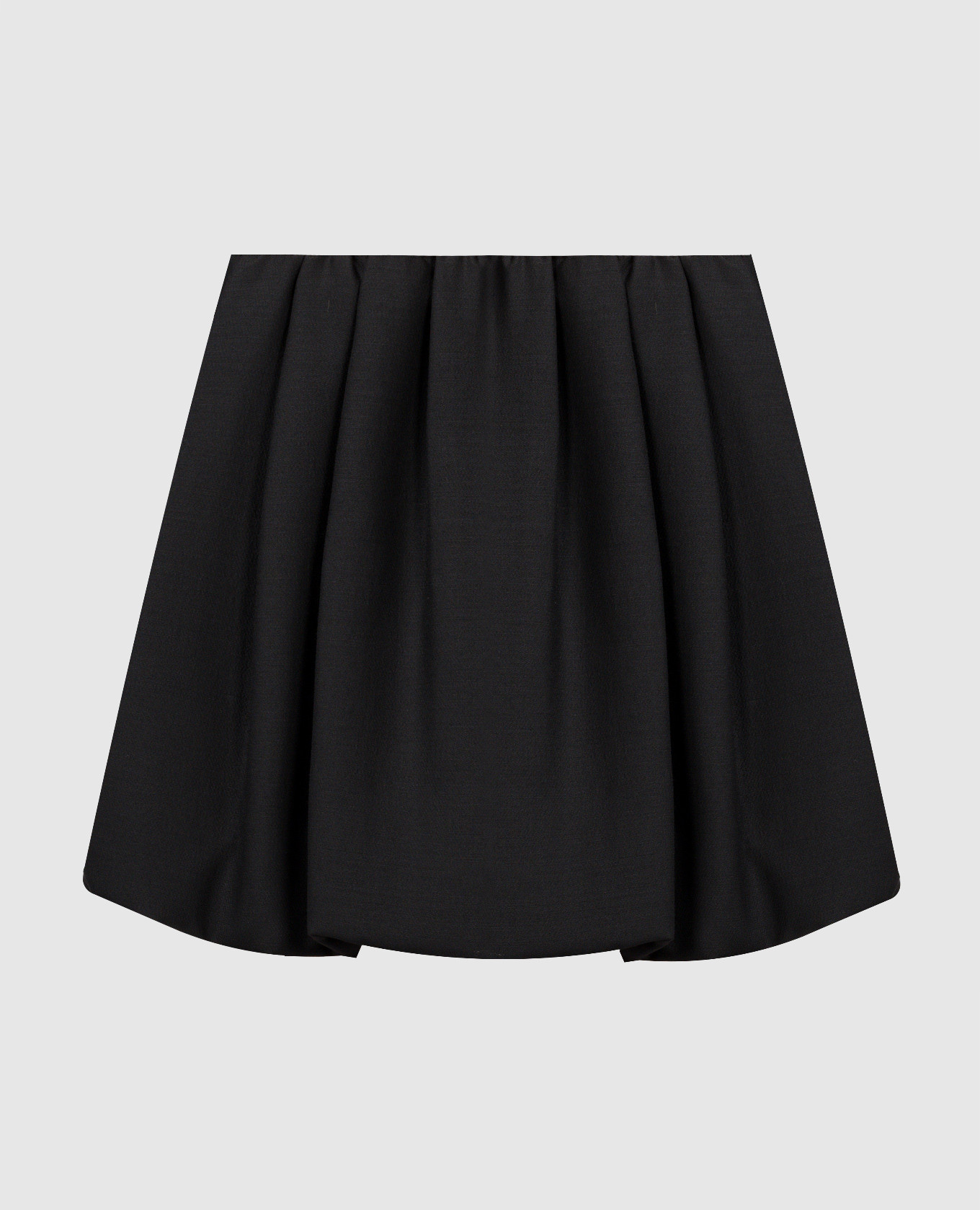 Черная юбка из шерсти и шелка с драпировкой.