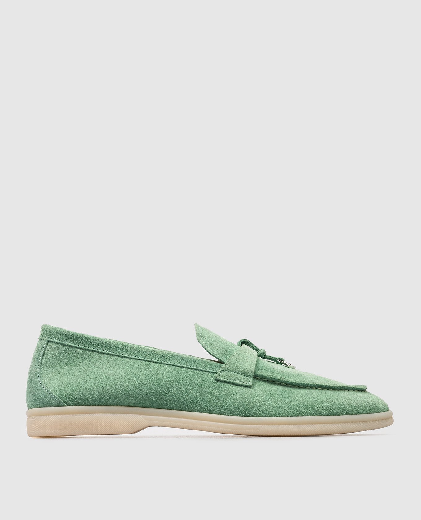 Green suede loafers with metallic logo
