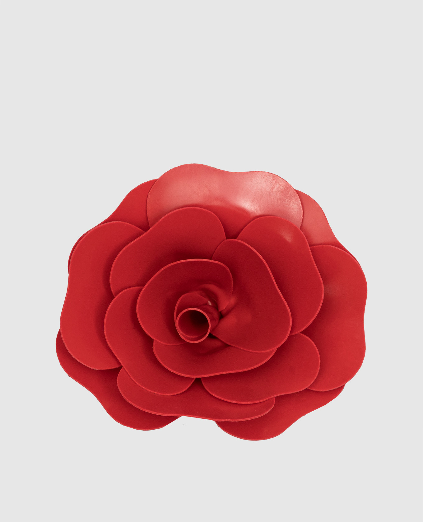 Red brooch in the form of a flower