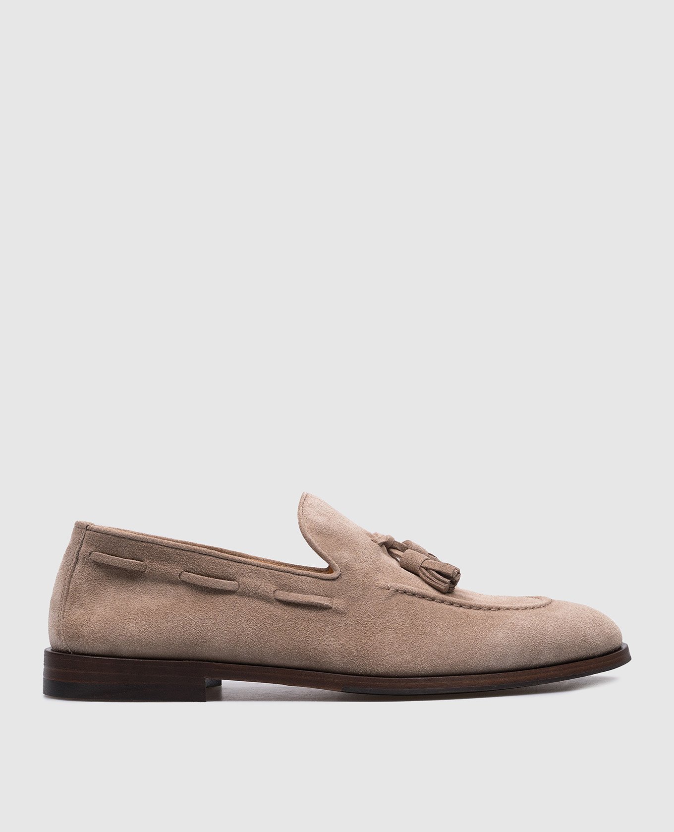 Beige suede loafers with tassels