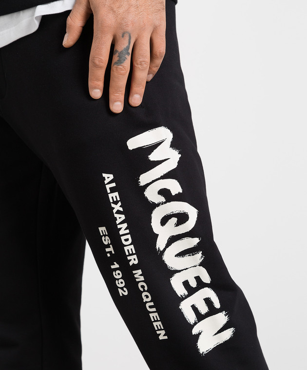 Black joggers with contrasting McQueen Graffiti print