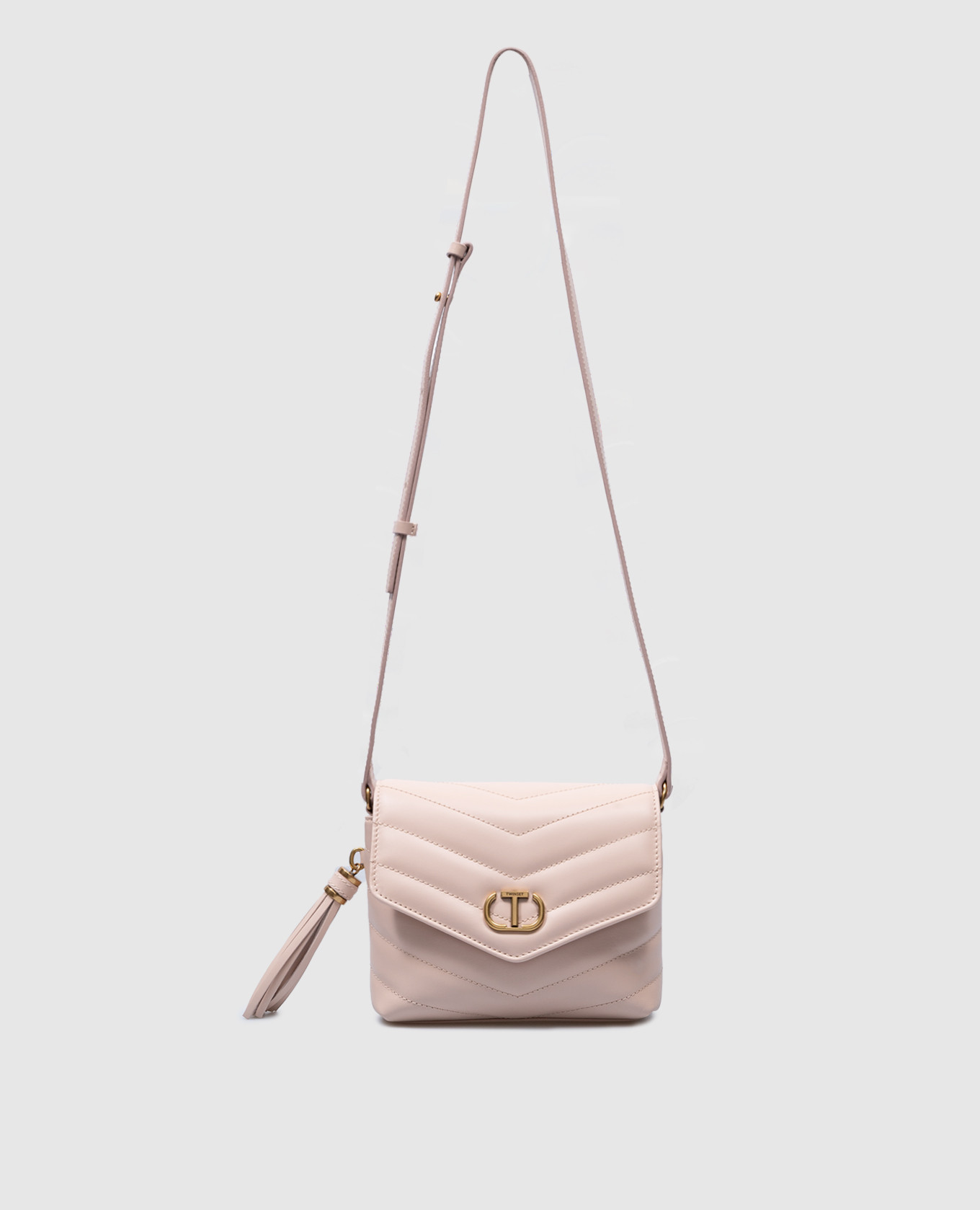 Beige quilted bag with metallic logo