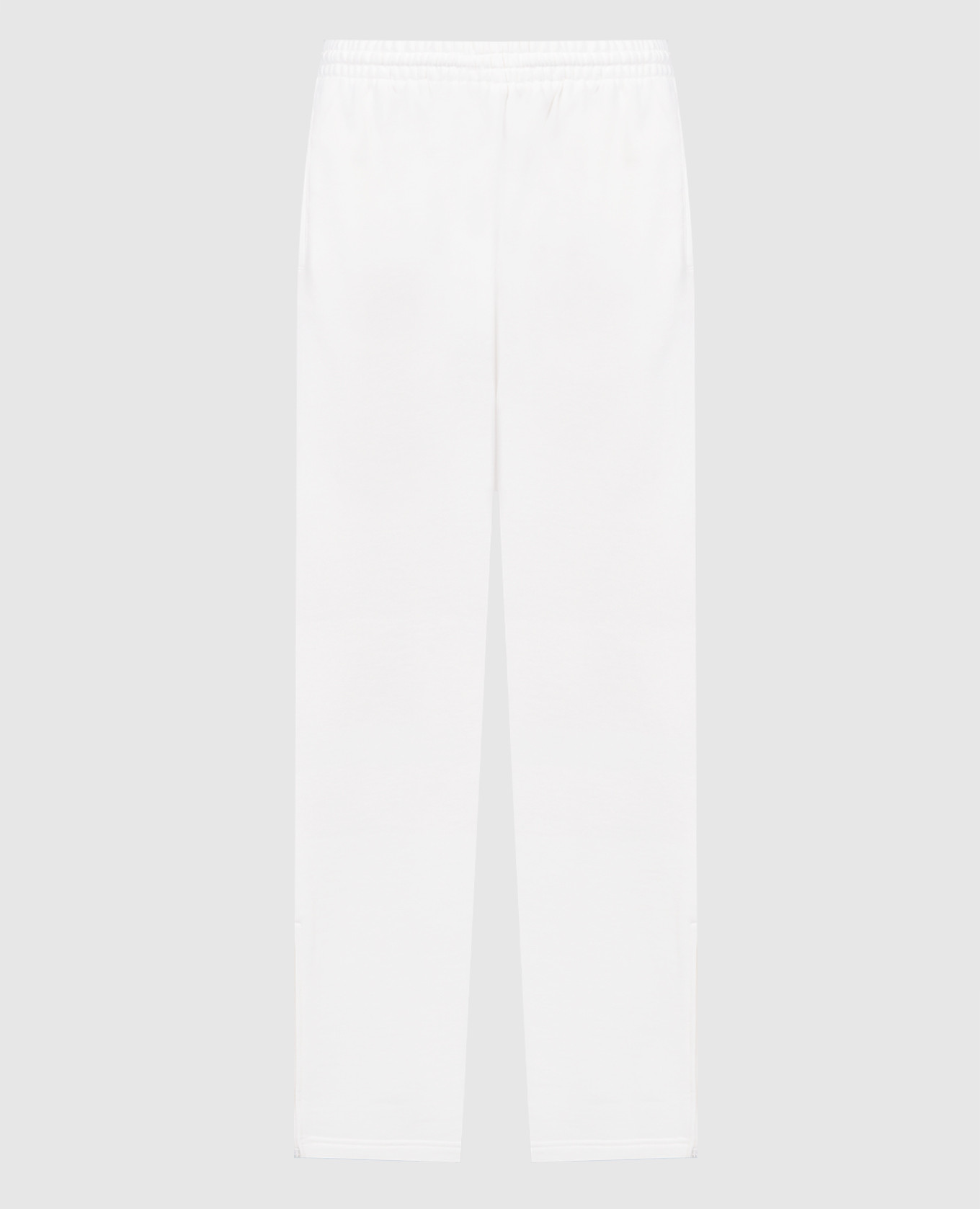 White pants with zippers in the side seams