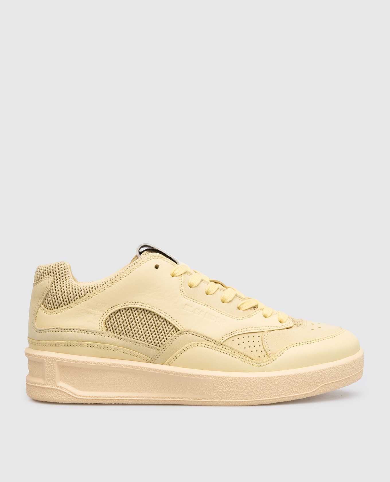 Yellow leather sneakers with a logo