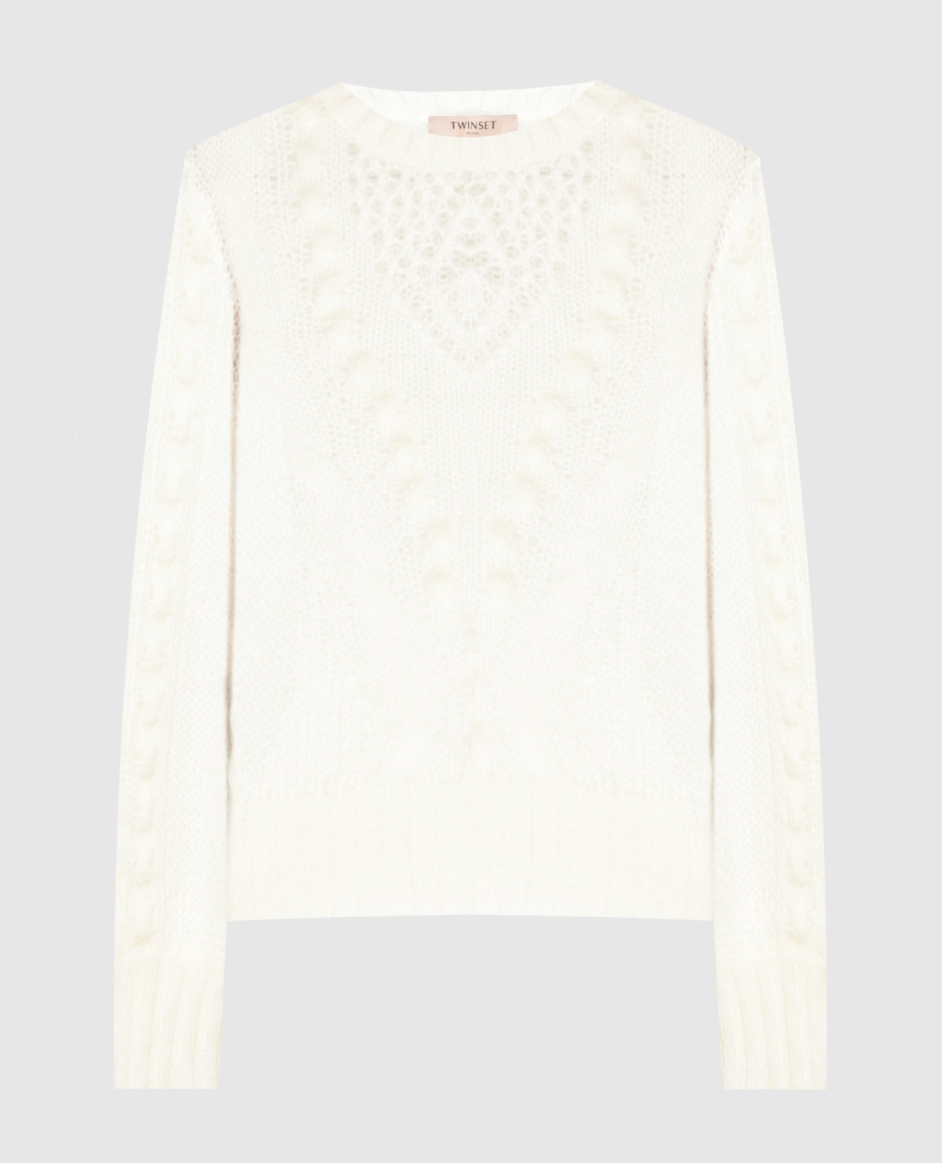 White openwork sweater in a pattern